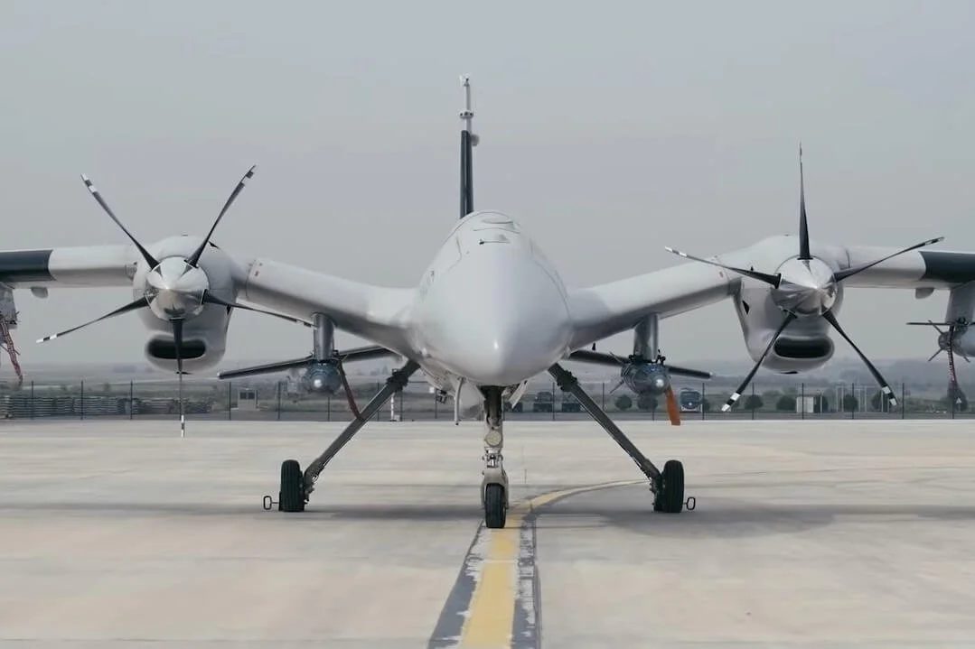 A twin-engine combat drone on a runway